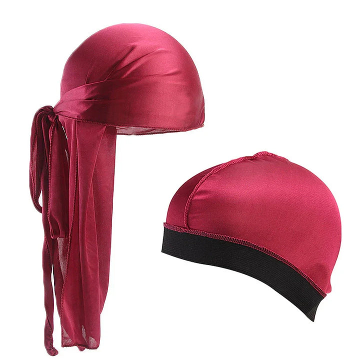 red satin durag with long tail and matching red satin cap with black elastic band