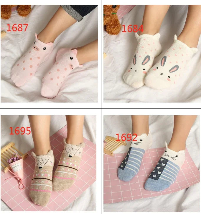 Four pairs of cute animal-themed ankle socks with pig, bunny, bear, and cat designs on white and pink backgrounds.