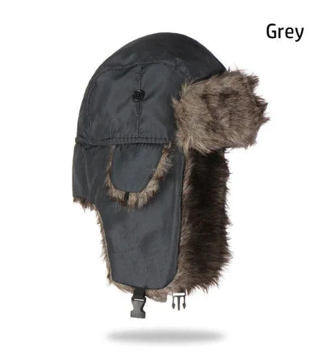 Grey winter trapper hat with faux fur lining and ear flaps on white background