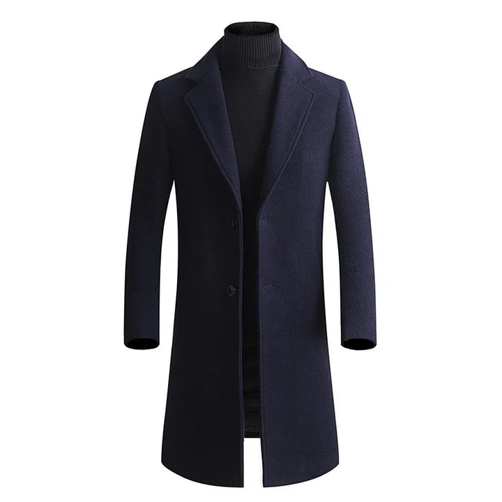 Men's navy blue wool overcoat with notch lapels and two-button closure over black turtleneck sweater