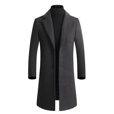 Dark gray men's wool blend overcoat with notch lapels worn over black turtleneck sweater