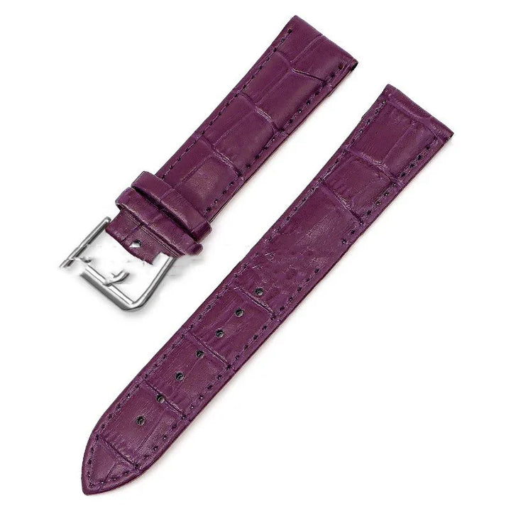 Purple leather watch strap with silver buckle and crocodile texture pattern
