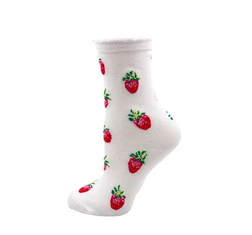 White ankle sock with red strawberry fruit pattern and green leaves on a white background