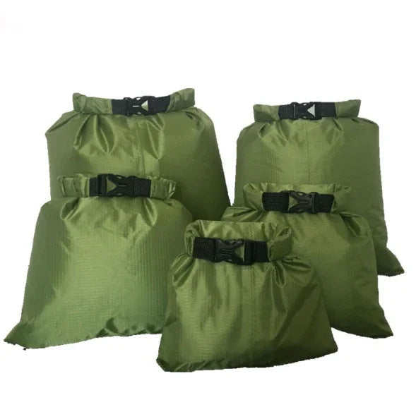 Set of five green waterproof dry bags with black buckles on white background.