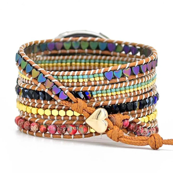 Colorful beaded wrap bracelet with heart-shaped beads and a gold heart clasp on brown leather