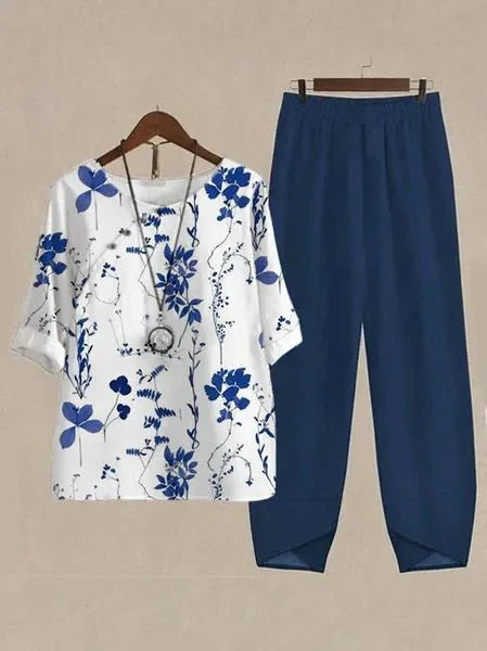 White blouse with blue floral print and navy blue tapered pants set for women