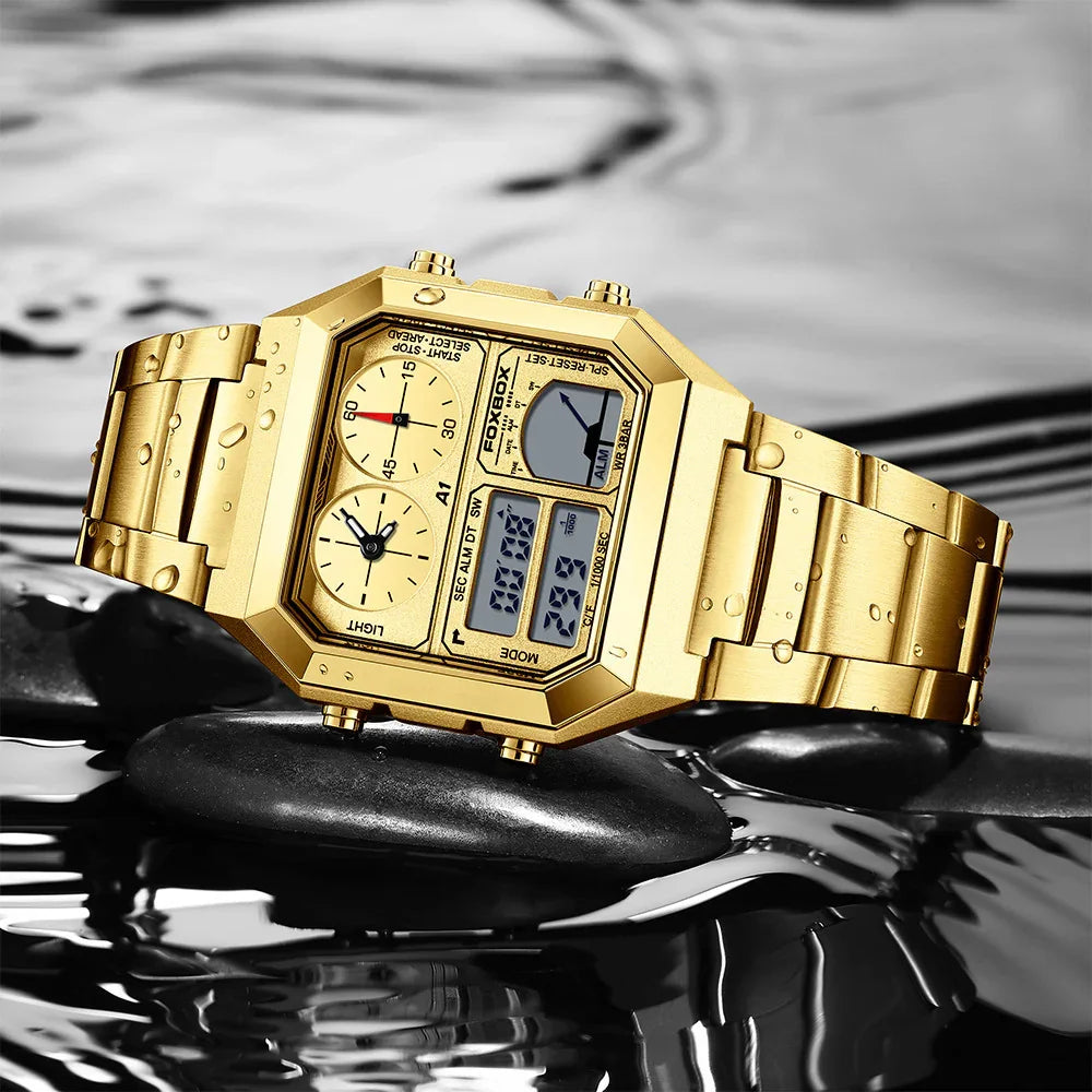 Gold digital and analog FOXBOX wristwatch with water droplets on black stones and reflective water surface