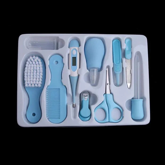 Blue baby grooming kit including brush, comb, thermometer, nail clippers, scissors, and nasal aspirator in plastic tray