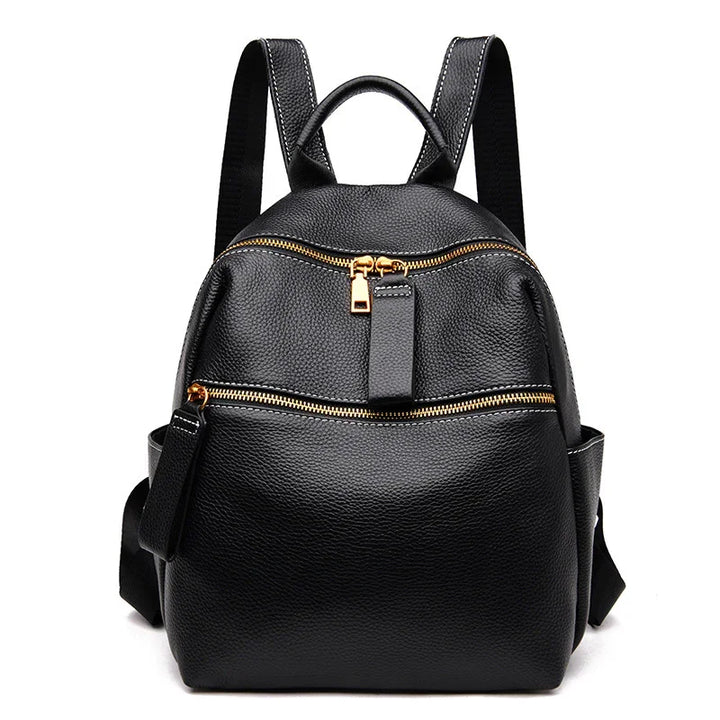 Black leather backpack with gold zippers, front pocket, and adjustable shoulder straps