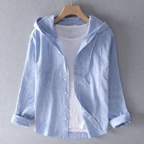 Light blue striped casual button-up shirt with hood over a plain white t-shirt on wooden hanger