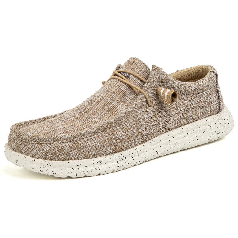 Men's casual slip-on shoe with beige textured fabric upper and white speckled sole