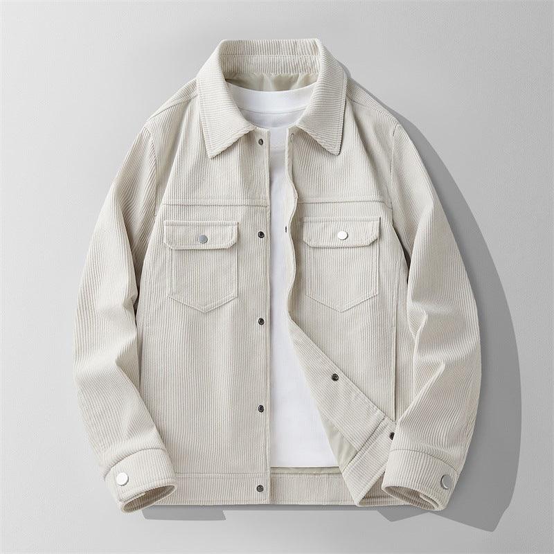Beige corduroy jacket with front flap pockets and snap buttons over a white T-shirt on gray background