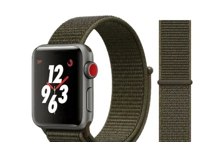 Apple Watch with olive green nylon sport loop band and black watch face showing white and red numbers