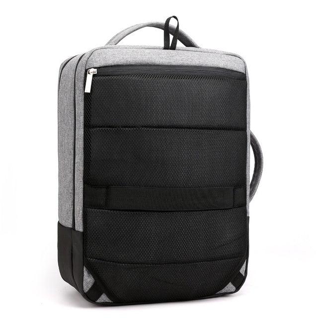 Modern grey and black padded backpack with front zipper pocket and top and side handles