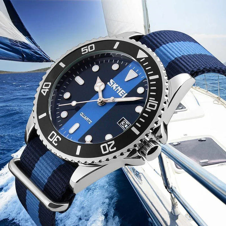 Close-up of a blue striped SKMEI quartz watch with black bezel on a sailing boat background