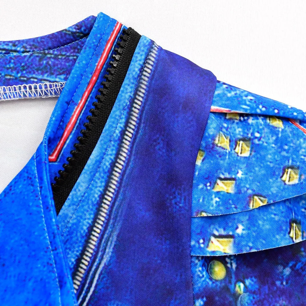 Close-up of blue fabric with black zipper and printed yellow studs pattern on clothing