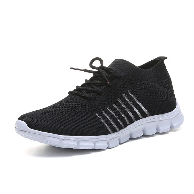 Black knit running shoe with white sole and lace-up design, breathable lightweight sneaker