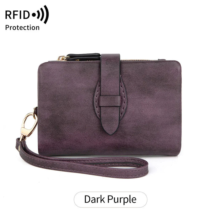 Dark purple RFID protection leather wristlet wallet with strap and gold hardware