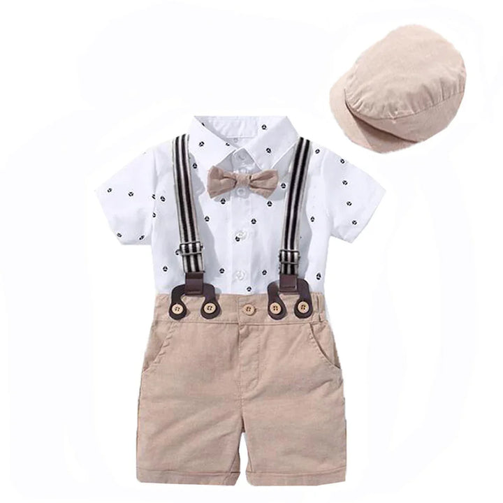 Toddler boys' summer outfit with white patterned shirt, beige shorts with suspenders, bow tie, and matching cap