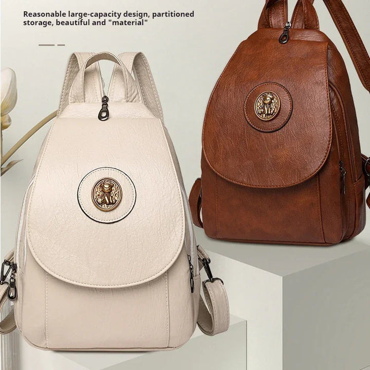 White and brown leather large-capacity backpacks with gold emblem, stylish partitioned storage design