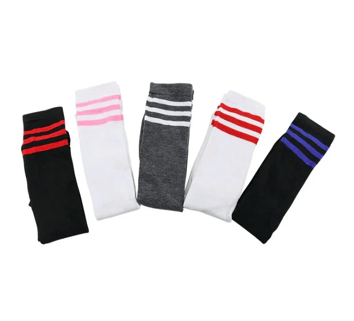 Five pairs of sporty knee-high socks in black, white, and gray with colorful stripes in red, pink, white, and blue