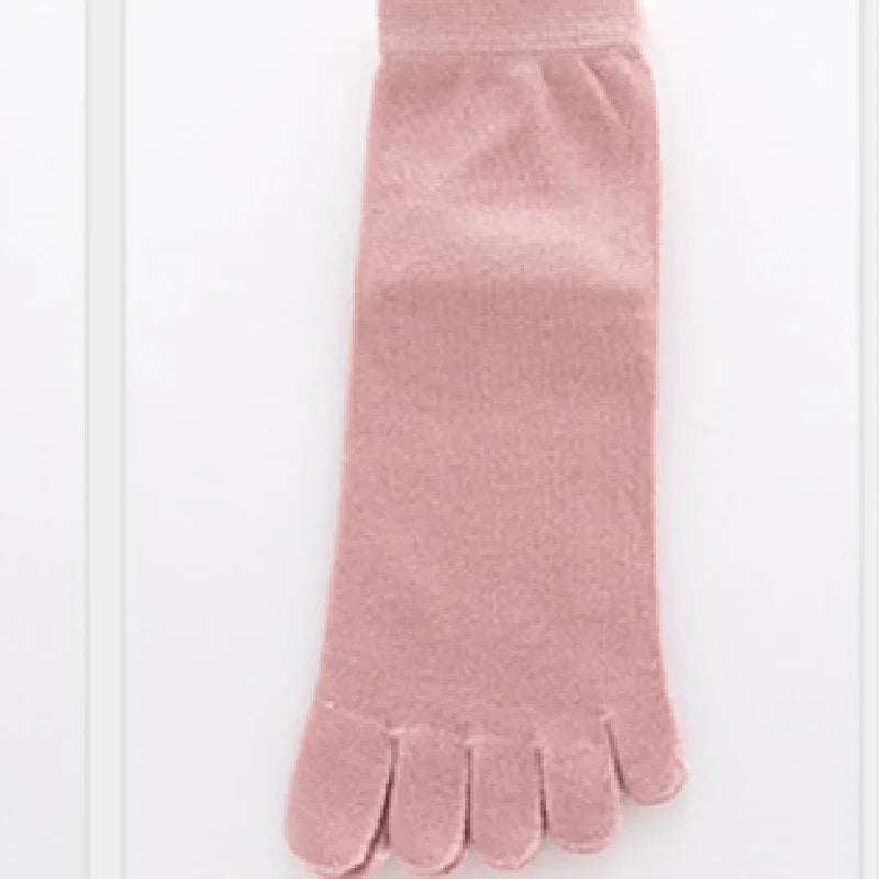 single pink toe sock made of soft fabric on white background