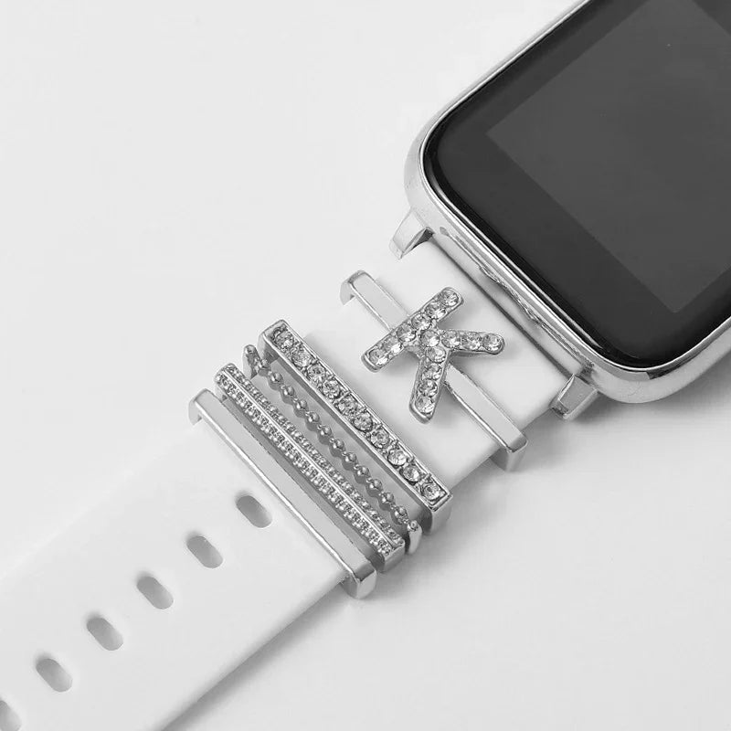 White smartwatch band decorated with silver and rhinestone alphabet K and bar charms