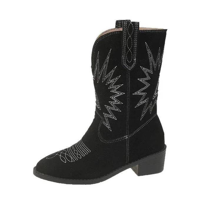 Black suede western cowboy boot with white decorative stitching and low stacked heel