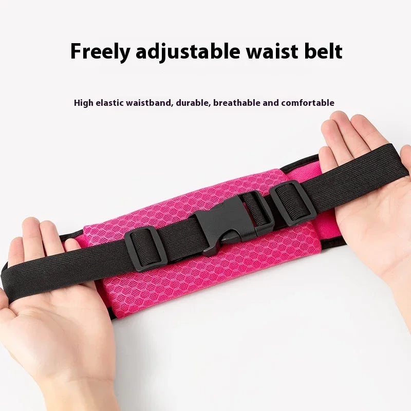 Freely adjustable pink waist belt with high elastic black waistband held by hands on white background
