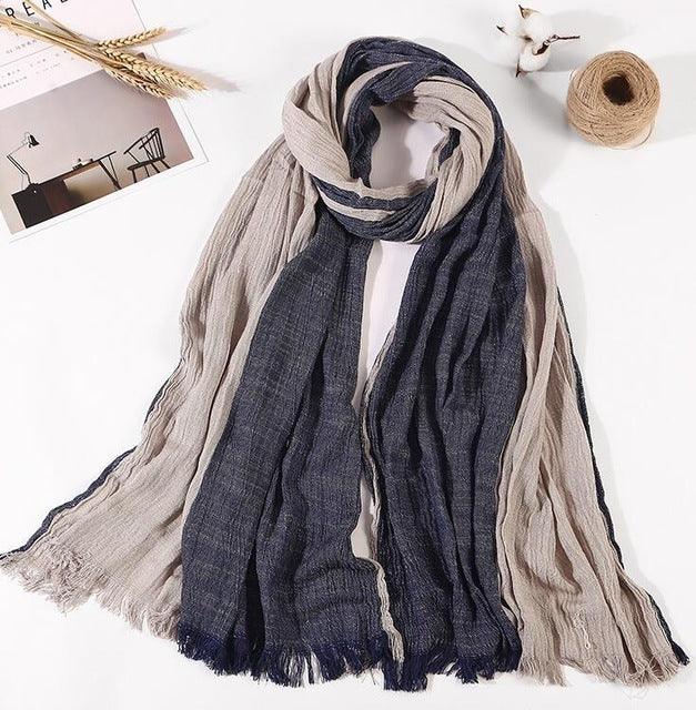 Soft lightweight scarf in beige and navy blue with fringed edges on white background