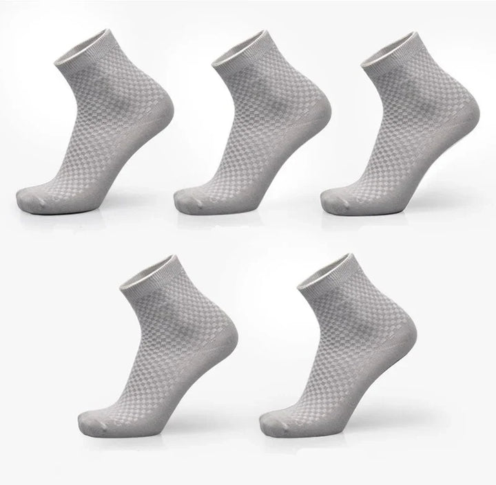 Five pairs of gray ankle socks with subtle checkered pattern displayed on white background