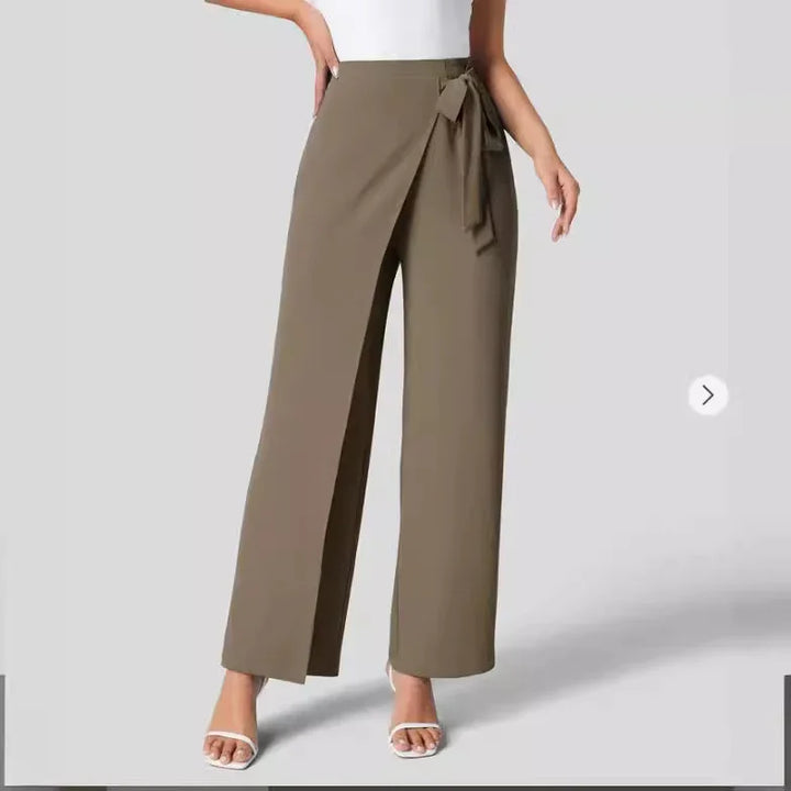 Women wearing high-waist khaki wrap pants with a side tie and white heeled sandals