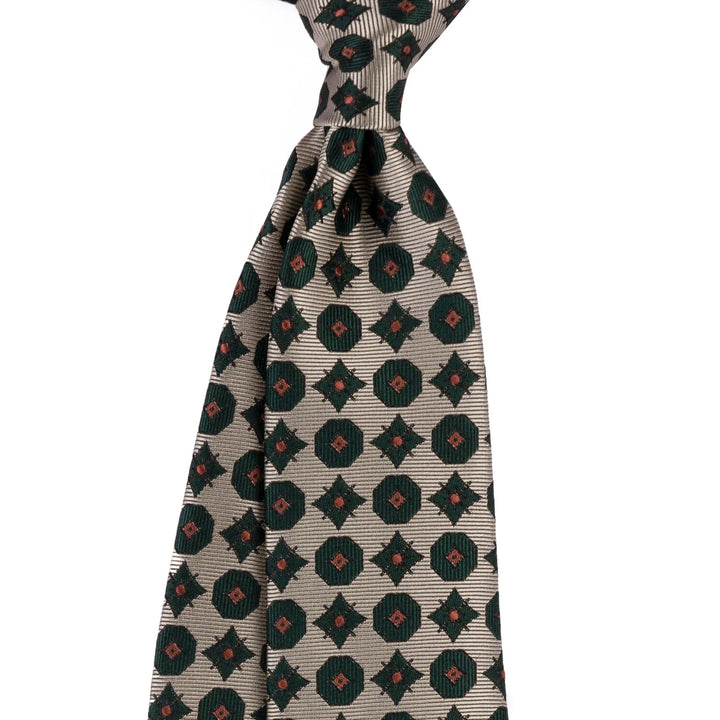 Beige silk necktie with dark green and brown geometric floral pattern