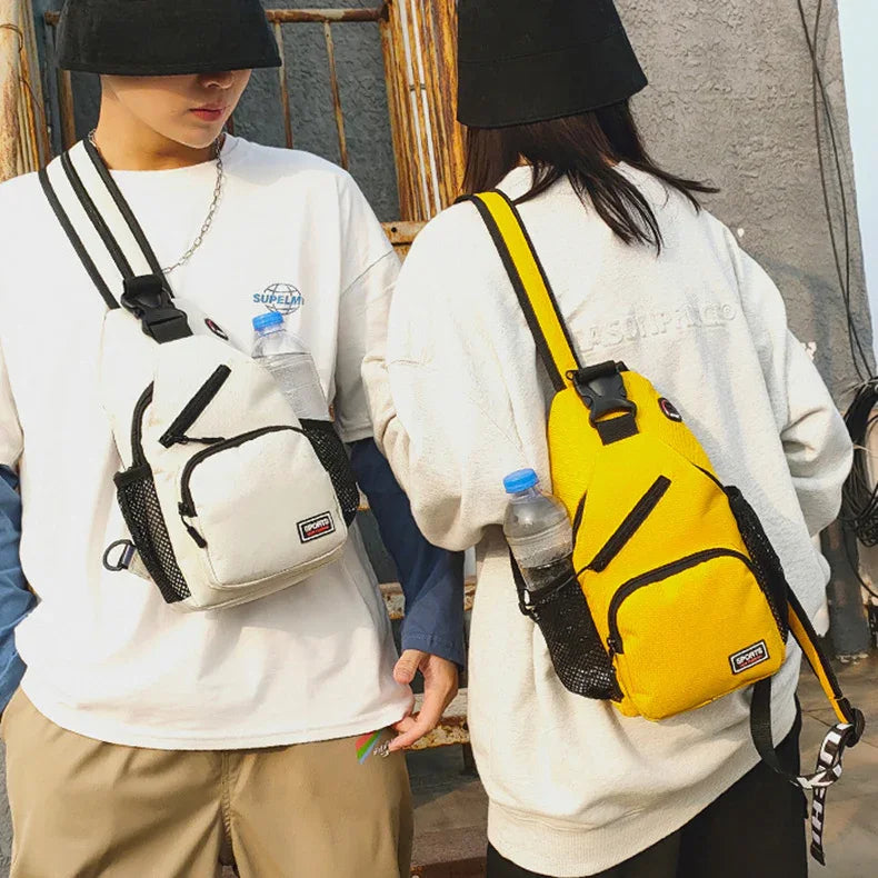 Two people wearing casual white tops and black bucket hats carrying sporty sling backpacks, one white and one yellow, each with a water bottle