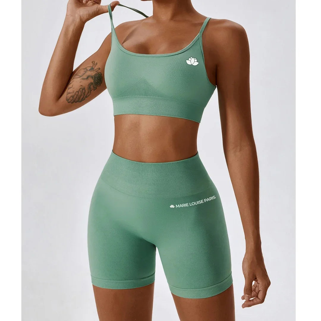 Woman in green seamless workout set, sports bra and shorts, Marie Louise Paris activewear
