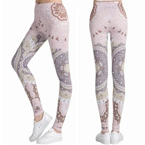 Women's high-waisted leggings with intricate pink, beige, and gray mandala floral patterns paired with white sneakers