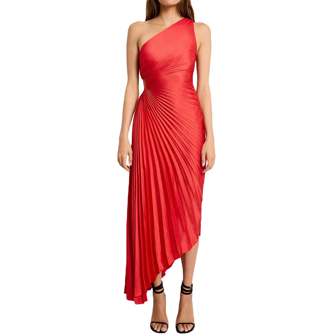 Woman wearing asymmetrical one-shoulder red pleated evening dress with black strappy heels