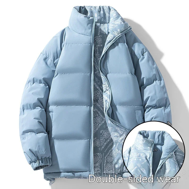 Light blue puffer jacket with paisley patterned reversible lining, zip front, and elastic cuffs