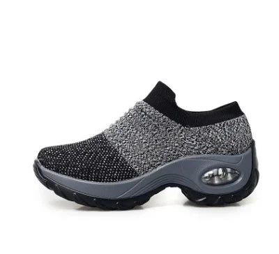 gray and black slip-on sport shoes with knitted upper and thick cushioned sole