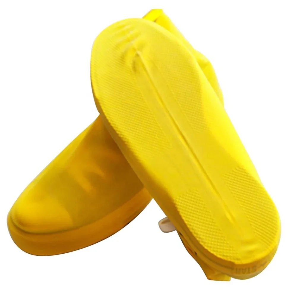 Pair of bright yellow waterproof rain shoe covers with textured non-slip soles