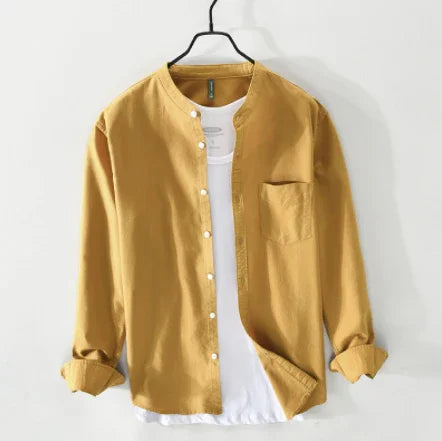Mustard yellow button-up shirt with mandarin collar over a white T-shirt on black hanger