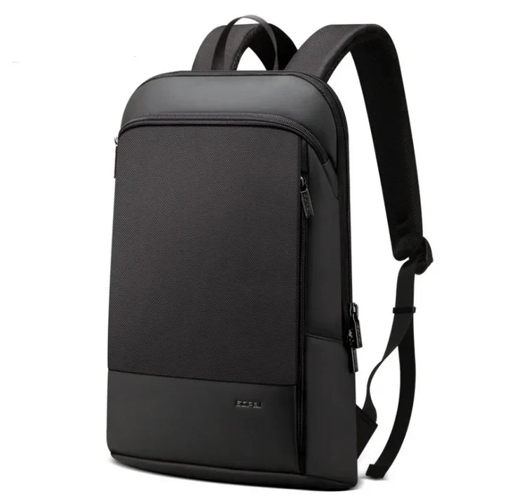 Sleek black minimalist backpack with padded straps and front zipper pocket on white background