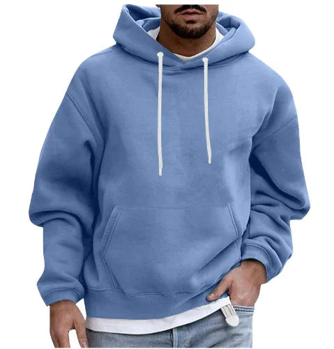Man wearing a light blue hoodie with white drawstrings and front pocket