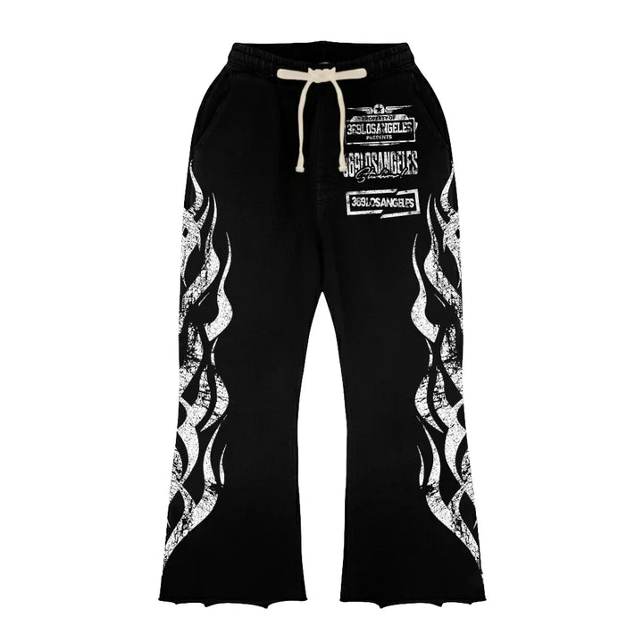 Black sweatpants with white flame graphics on legs and white text print on front with drawstring waistband