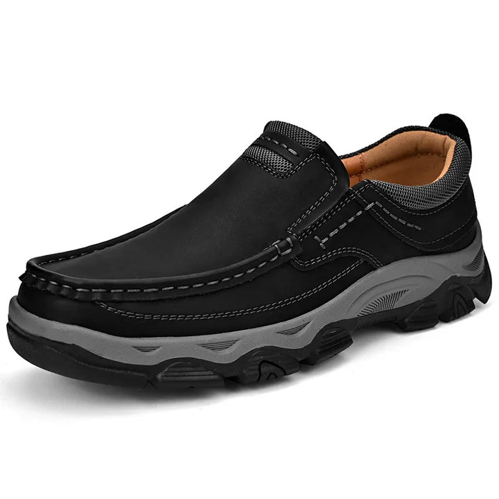 Black casual slip-on men's shoe with gray thick sole and stitched leather upper