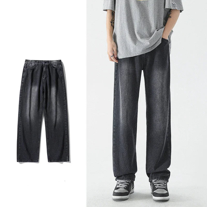 Black washed loose fit denim jeans shown flat and worn with gray shirt and sneakers