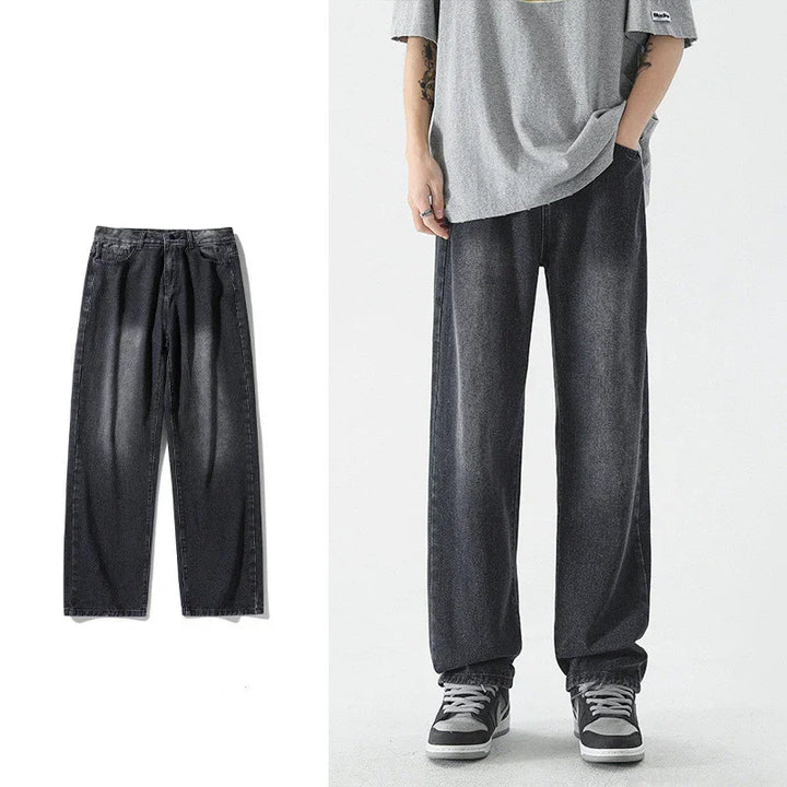 Black washed loose fit denim jeans shown flat and worn with gray shirt and sneakers