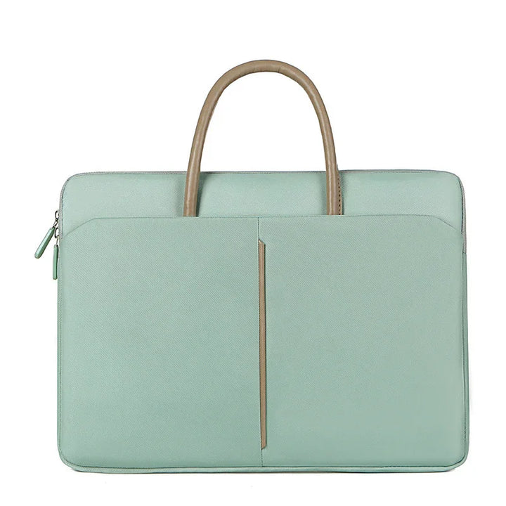 Mint green laptop bag with tan handle and front zippered pocket on white background