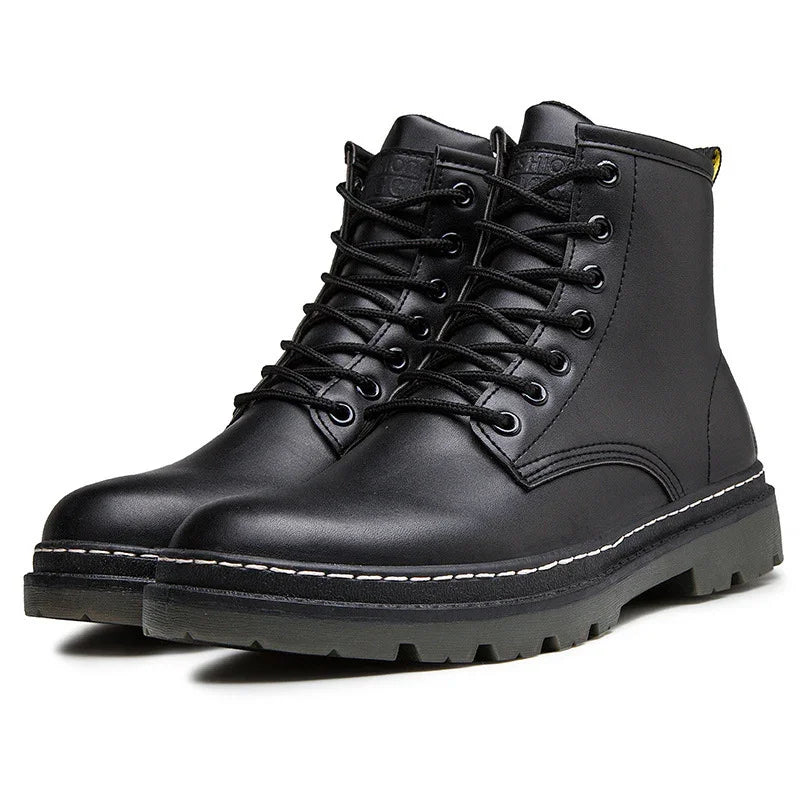 Pair of black leather lace-up boots with rugged sole and white stitching detail
