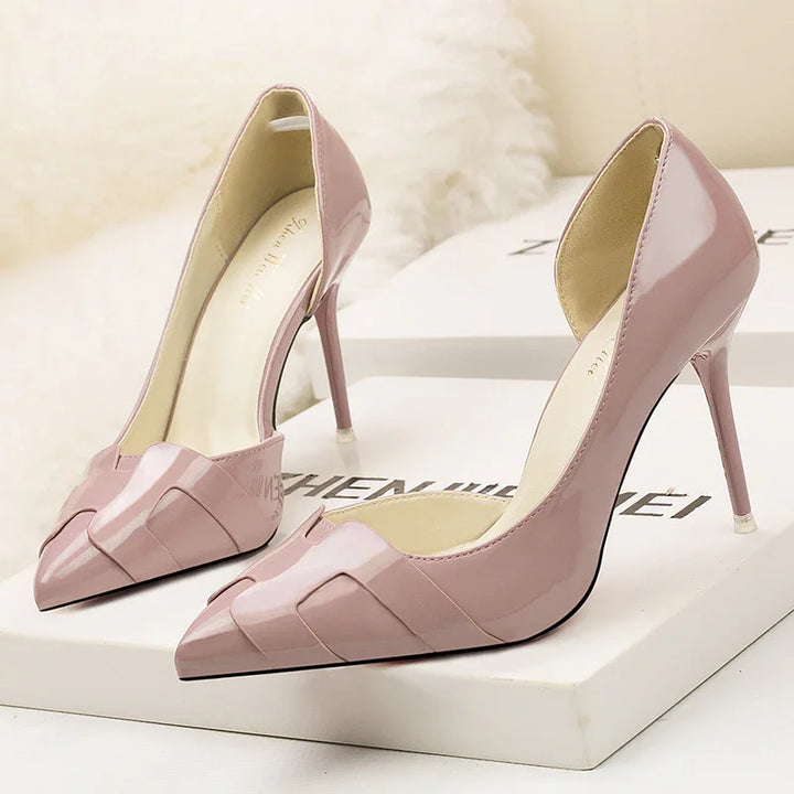 Elegant blush pink patent leather high heel shoes with pointed toes on white box